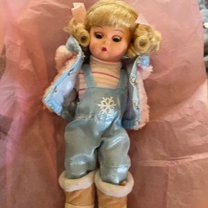 Madame Alexander winter doll with sled like new with stand.
